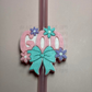 God with bow and flowers straw topper